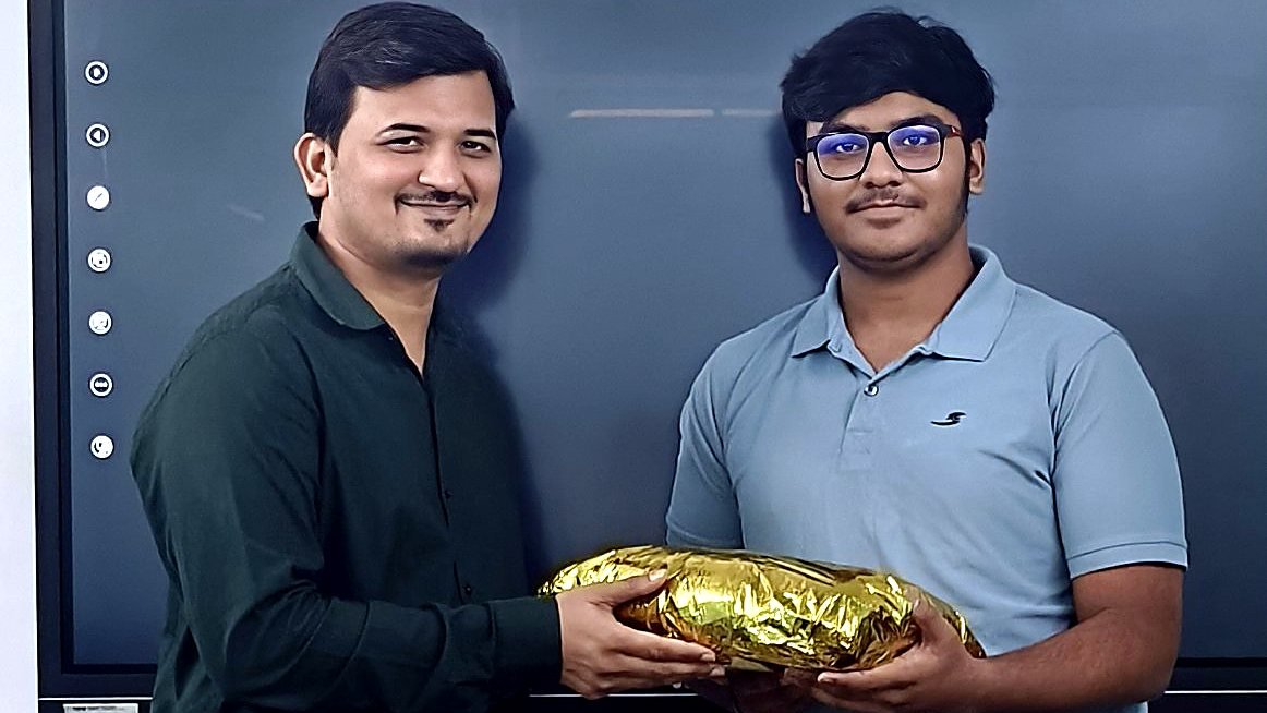 Ronak Sir rewarding a student