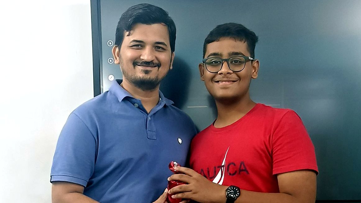 Ronak Sir rewarding a student